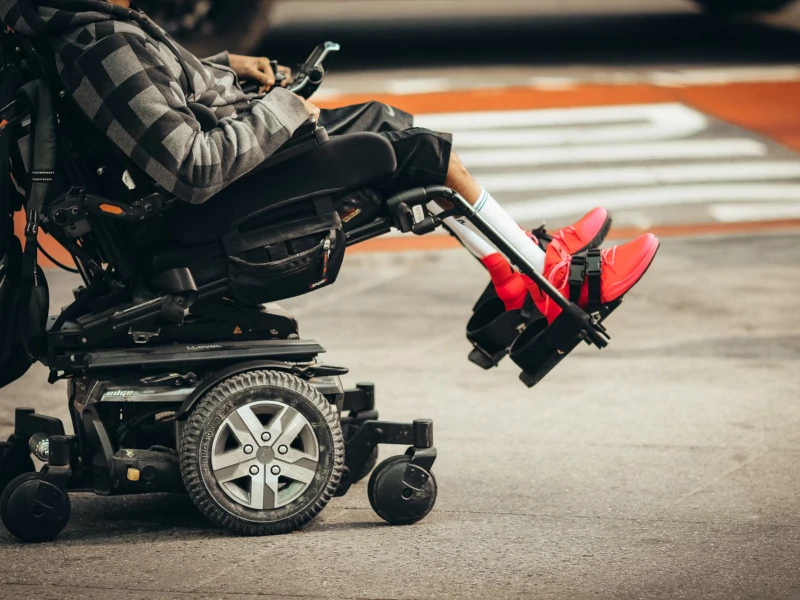 Disabled senior in a power wheelchair