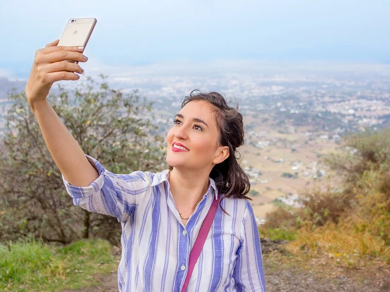 Woman taking a selfie.